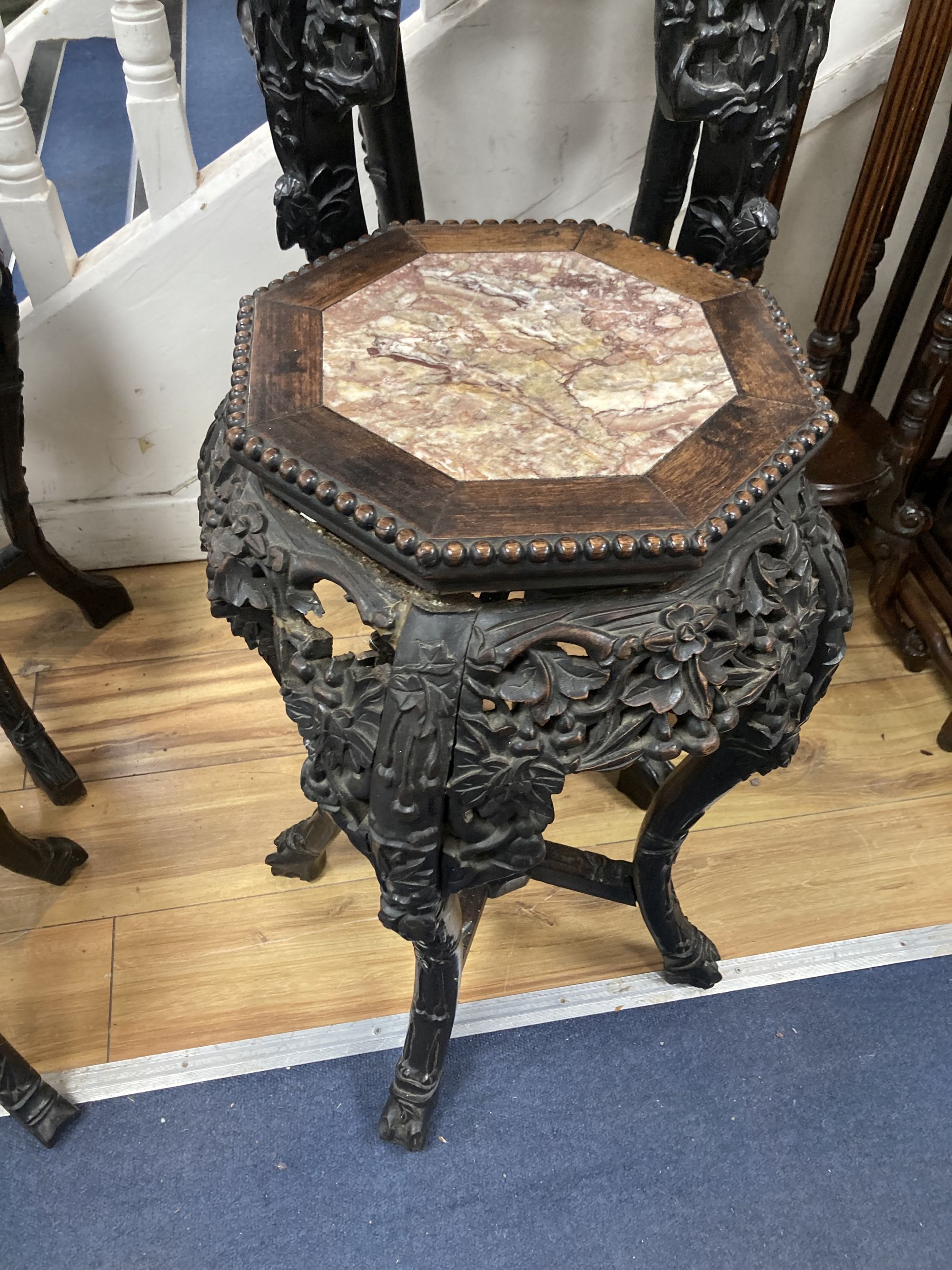 Two Chinese hongmu and marble inset octagonal stands, late 19th century, largest width 40cm height 90cm